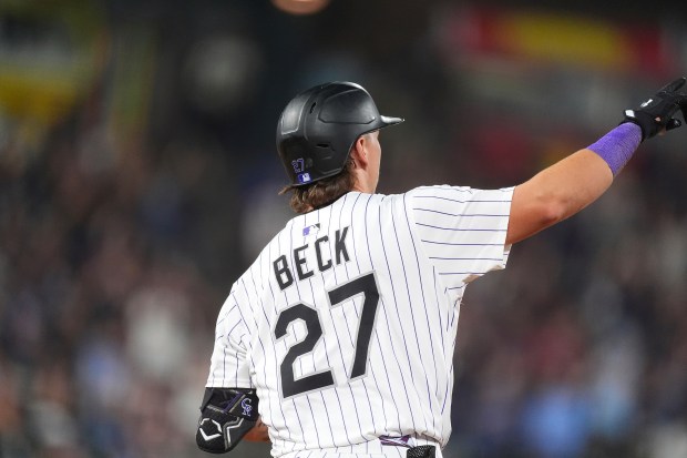 Colorado Rockies' Jordan Beck gestures to the bullpen as he circles the bases after hitting a three-run home run off San Diego Padres relief pitcher Jeremiah Estrada in the seventh inning of a baseball game Saturday, Sept. 6, 2025, in Denver. (AP Photo/David Zalubowski)