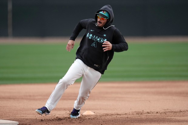 Arizona Diamondbacks' Nolan Arenado runs the bases during workouts during spring training baseball Wednesday, Feb. 18, 2026, in Scottsdale, Ariz. (AP Photo/Ross D. Franklin)