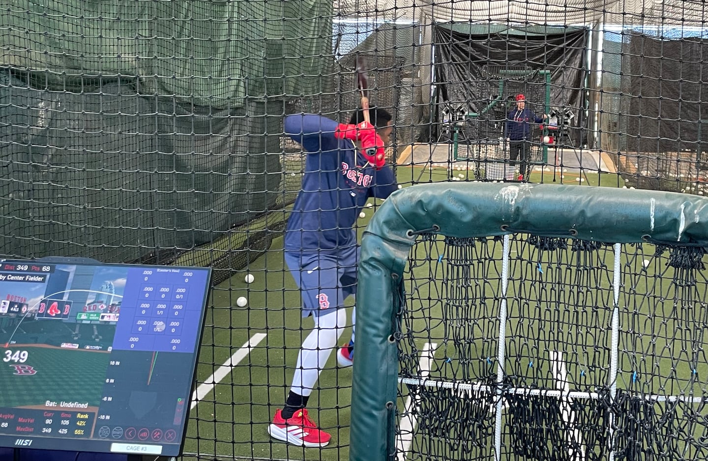 Red Sox prospect Yoeilin Cespedes's batting practice is monitored by a HitTrax system at the team's facility in Fort Myers, Fla.