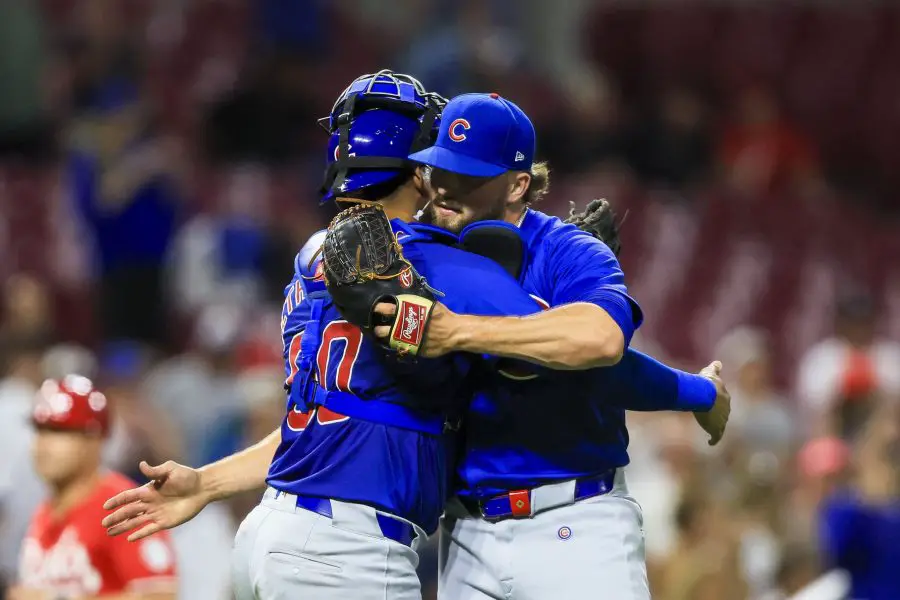 Chicago Cubs relief pitcher Porter Hodge (37) hugs catcher Christian Bethancourt (60) after the victory over the Cincinnati Reds at Great American Ball Park.