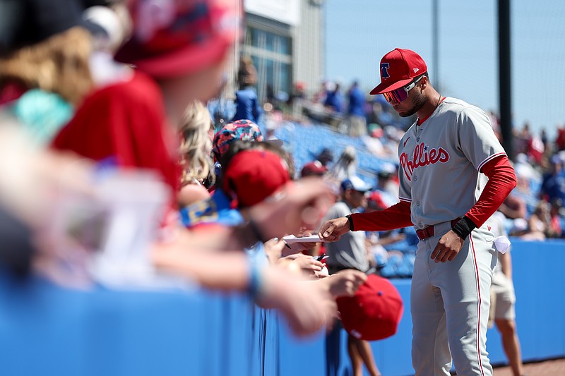 Mar 2, 2025; Dunedin, Florida, USA; Philadelphia Phillies outfielder Justin Crawford (80) signs autographs for fans before a game against the Toronto Blue Jays during spring training at TD Ballpark. Mandatory Credit: Nathan Ray Seebeck-Imagn Images