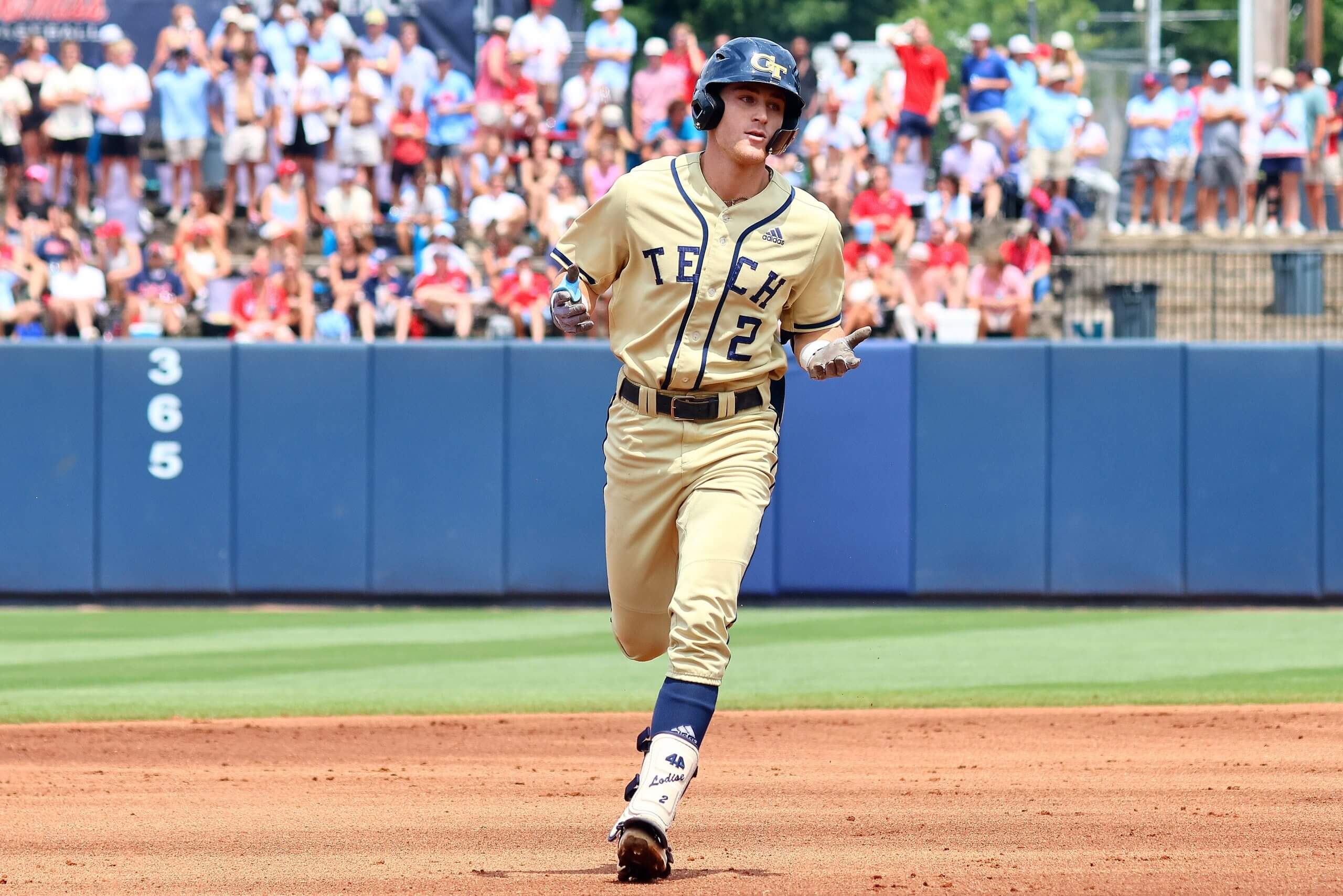 Georgia Tech Yellowjackets shortstop Kyle Lodise, wearing No. 2 on his jersey, runs the bases after a home run against the Mississippi Rebels. 
