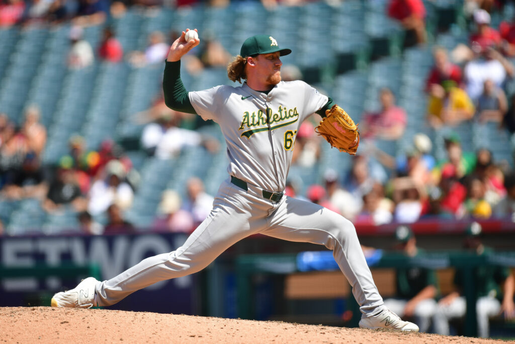 A's Designate Grant Holman, Mitch Spence For Assignment