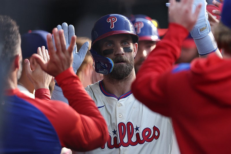 Aug 2, 2025; Philadelphia, Pennsylvania, USA; Philadelphia Phillies first base Bryce Harper (3) high fives teammates after hitting a two RBI home run against the Detroit Tigers during the eighth inning at Citizens Bank Park. Mandatory Credit: Bill Streicher-Imagn Images