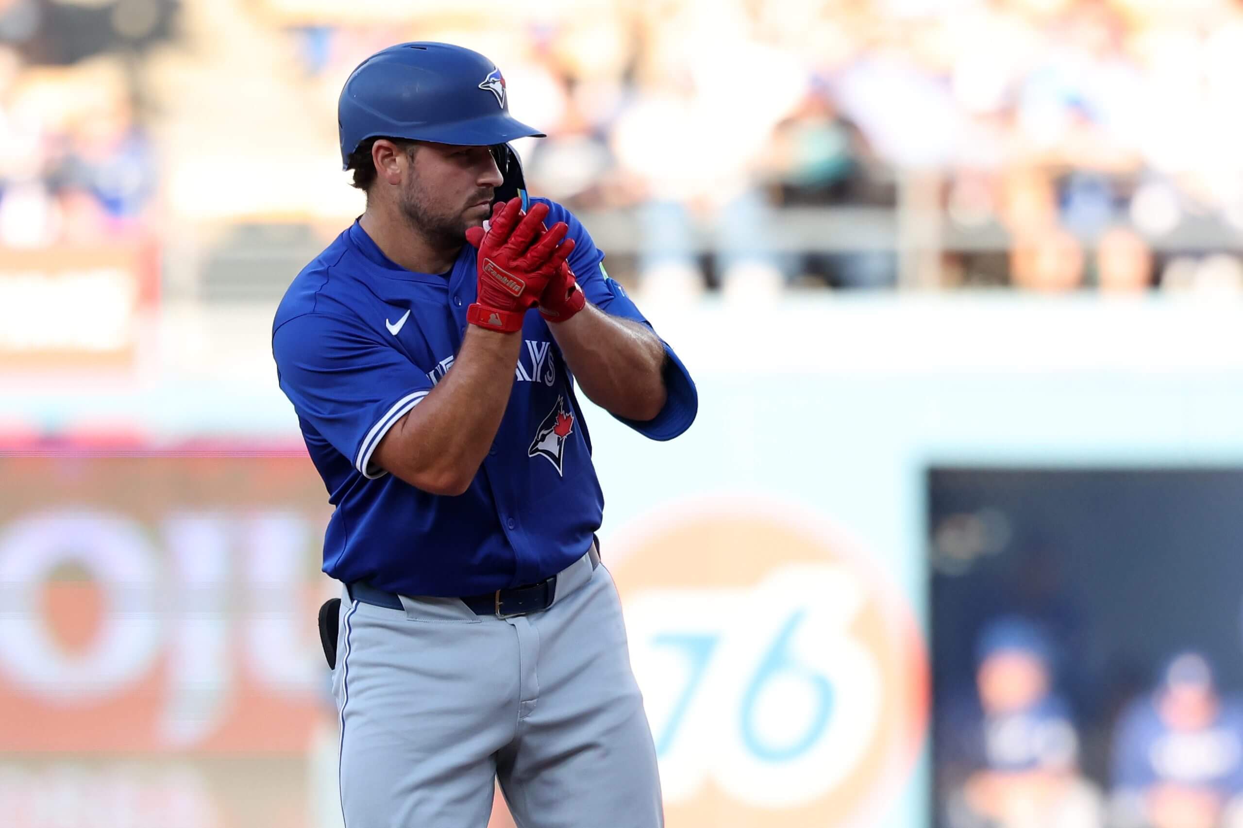 Toronto Blue Jays first base Buddy Kennedy (24) reacts after hitting a double during the third inning at Dodger Stadium. 