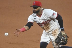 Aug 12, 2025; Cleveland, Ohio, USA; Cleveland Guardians first baseman Carlos Santana (41) tosses the ball to first base in the ninth inning against the Miami Marlins at Progressive Field. Mandatory Credit: David Richard-Imagn Images