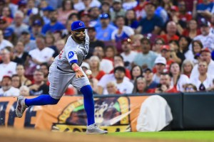 Sep 19, 2025; Cincinnati, Ohio, USA; Chicago Cubs first baseman Carlos Santana (41) throws to first to get Cincinnati Reds outfielder Noelvi Marte (not pictured) out in the third inning at Great American Ball Park. Mandatory Credit: Katie Stratman-Imagn Images