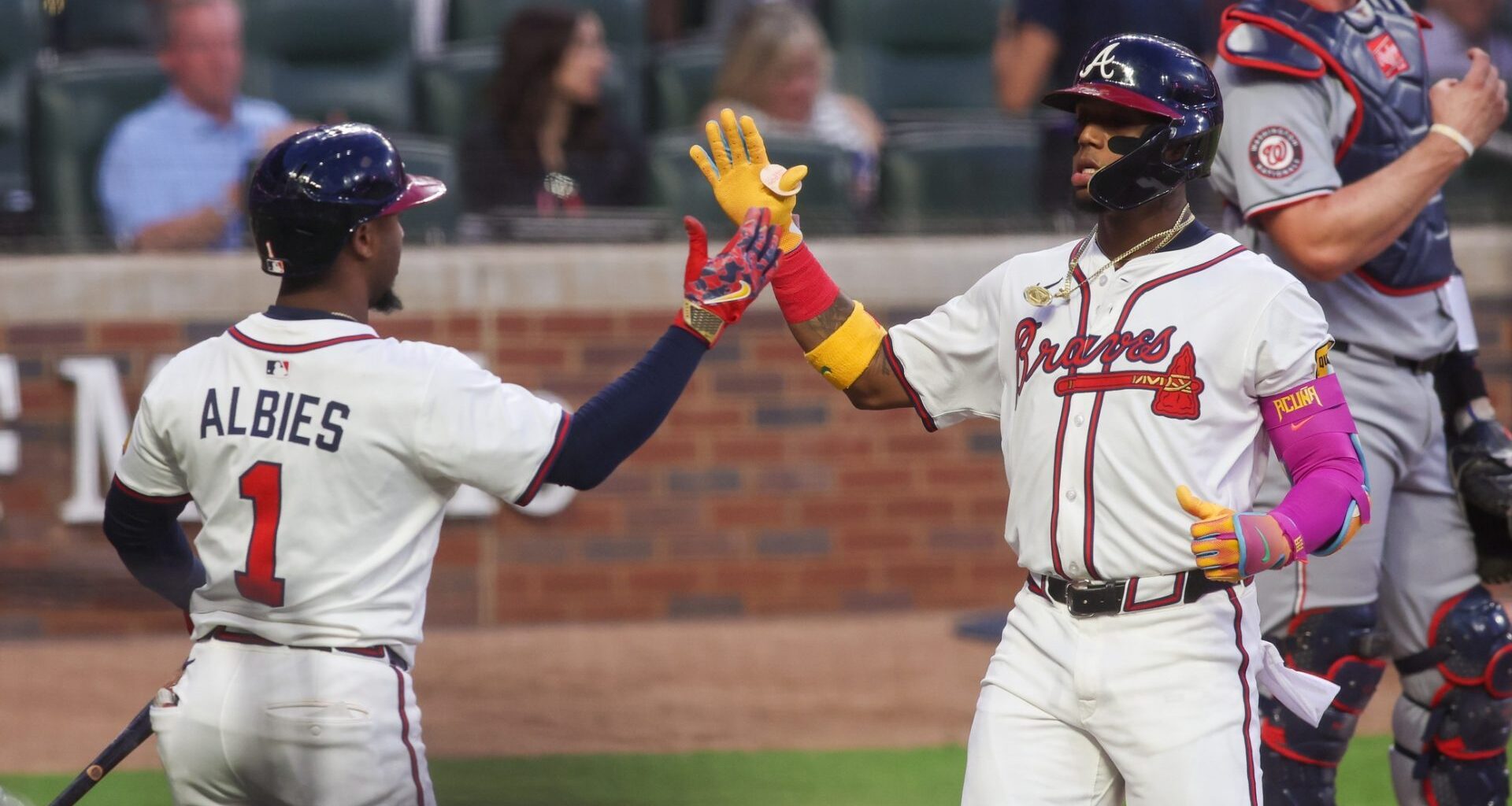 Sep 22, 2025; Atlanta, Georgia, USA; Atlanta Braves right fielder Ronald Acuna Jr. (13) celebrates with second baseman Ozzie Albies (1) after a home run against the Washington Nationals in the first inning at Truist Park.