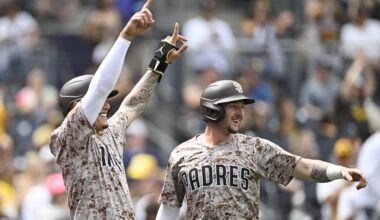 Sep 28, 2025; San Diego, California, USA; San Diego Padres third baseman Manny Machado (13), left, and Jackson Merrill (3) celebrate after scoring during the first inning against the Arizona Diamondbacks at Petco Park.