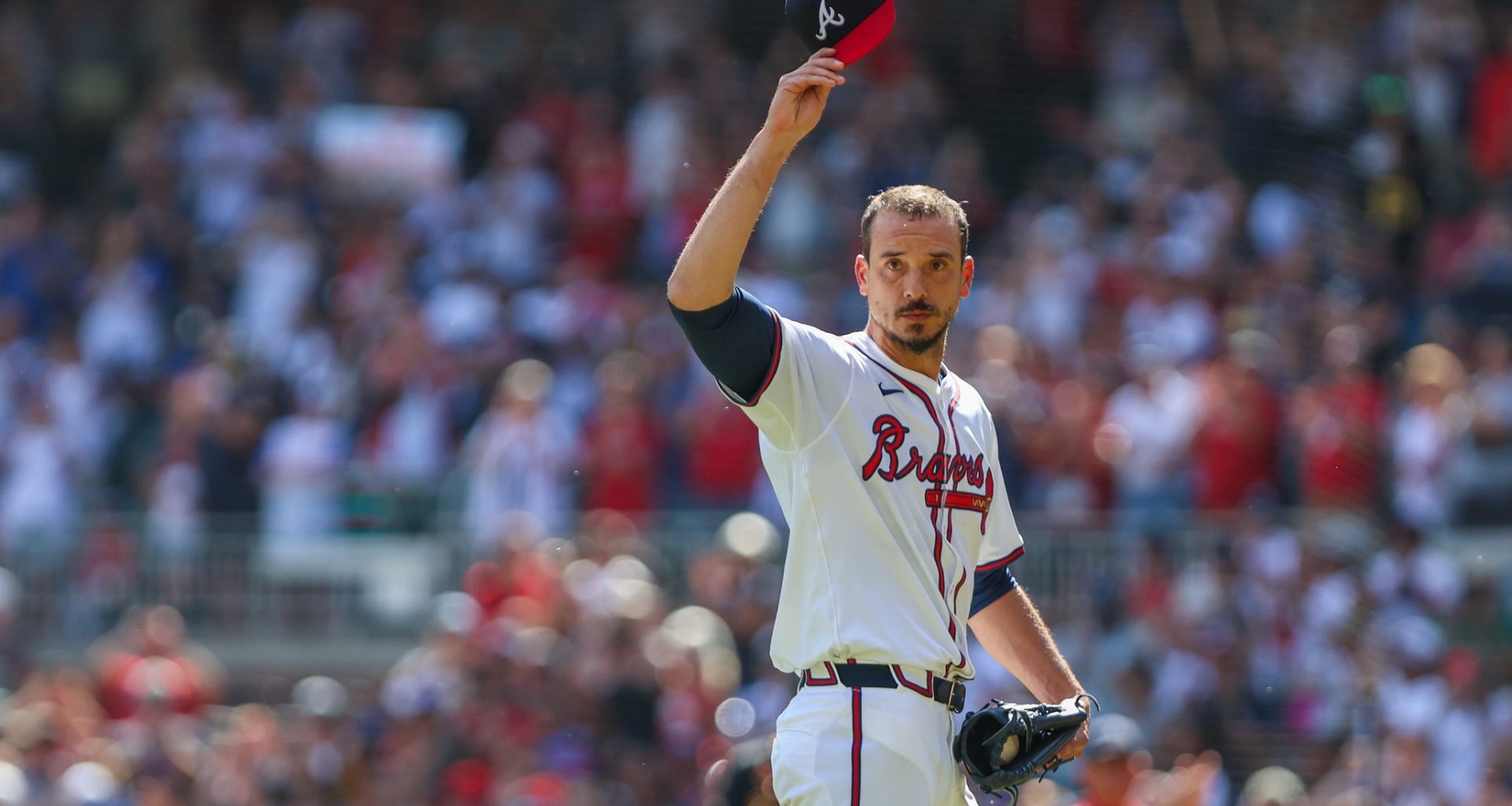 Sep 28, 2025; Cumberland, Georgia, USA; Atlanta Braves pitcher Charlie Morton (50) waves to fans while walking to the dugout after pitching against the Pittsburgh Pirates during the second inning at Truist Park.