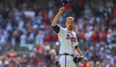 Sep 28, 2025; Cumberland, Georgia, USA; Atlanta Braves pitcher Charlie Morton (50) waves to fans while walking to the dugout after pitching against the Pittsburgh Pirates during the second inning at Truist Park.