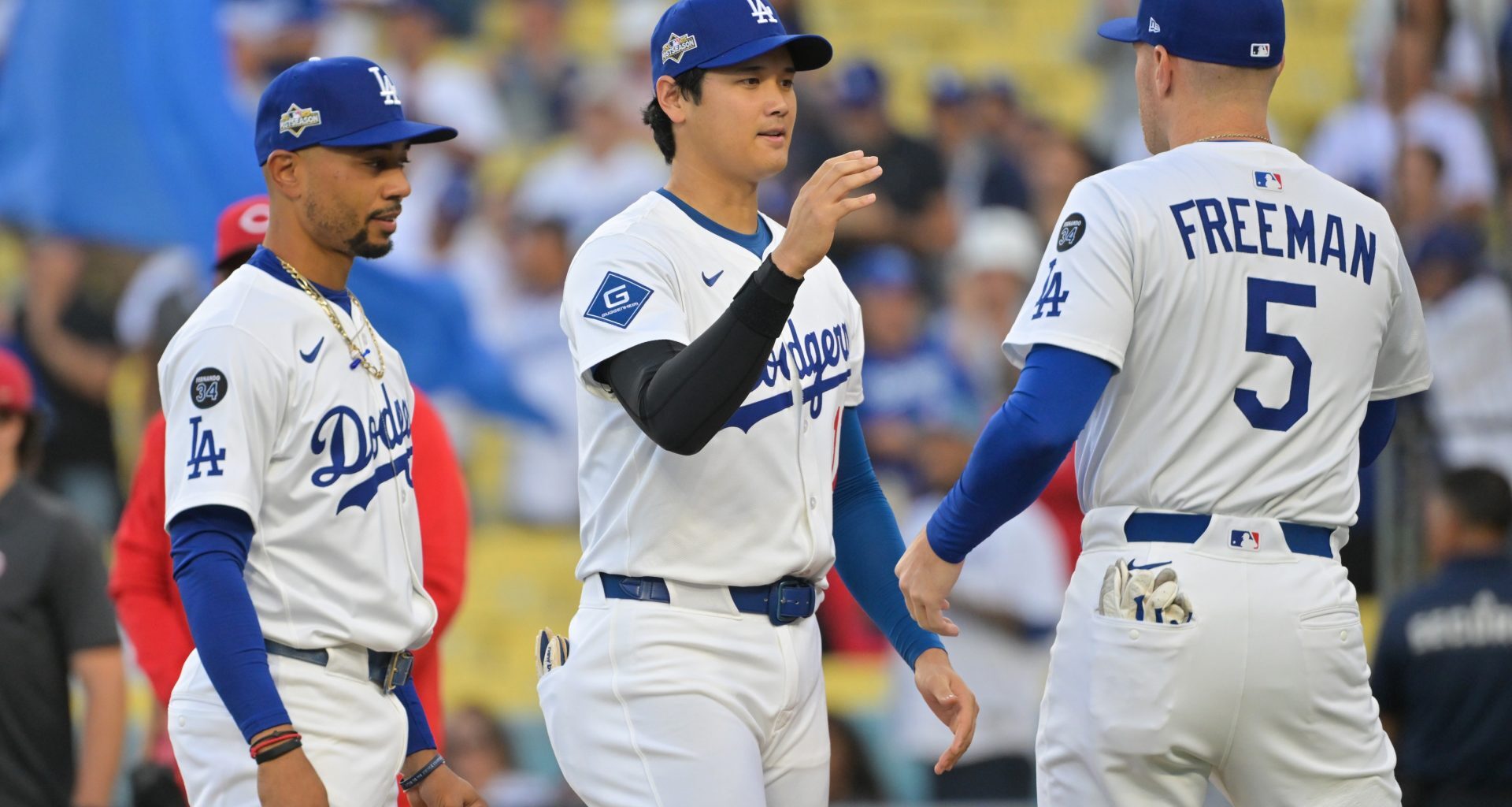 Sep 30, 2025; Los Angeles, California, USA; Los Angeles Dodgers designated hitter Shohei Ohtani (17) greets Los Angeles Dodgers first baseman Freddie Freeman (5) before the game against the Cincinnati Reds during game one of the Wildcard round for the 2025 MLB playoffs at Dodger Stadium.