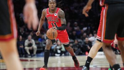 Feb 1, 2026; Miami, Florida, USA; Chicago Bulls guard Ayo Dosunmu (11) brings th ball up the court against the Miami Heat during the first half at Kaseya Center.