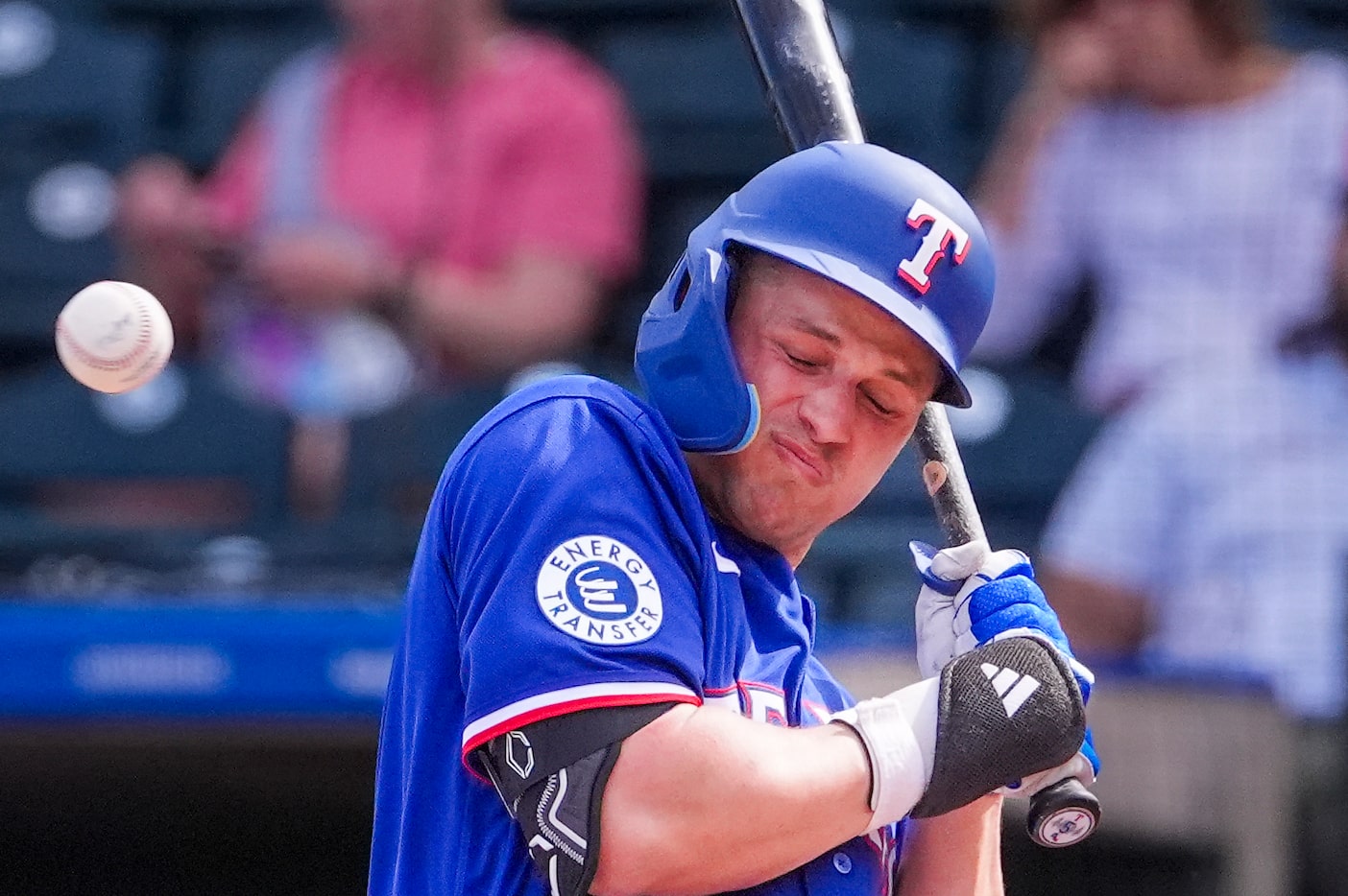 Texas Rangers shortstop Corey Seager backs away from an inside pitch during the third inning...