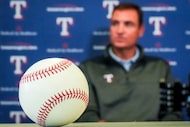 A baseball rests on a table as Texas Rangers president of baseball operations Chris Young...
