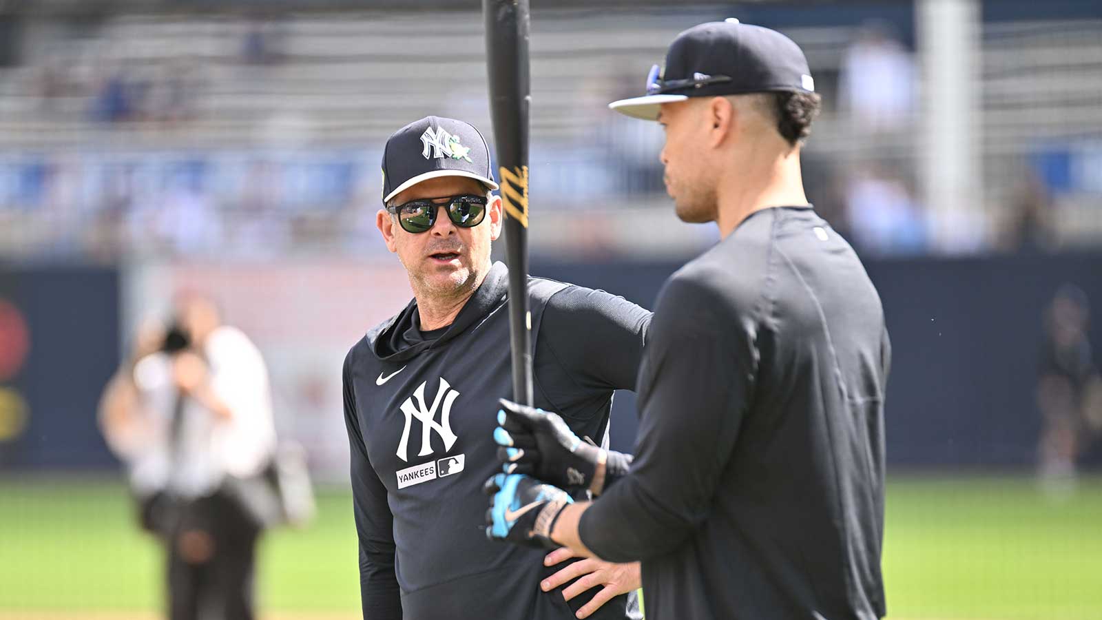 New York Yankees manager Aaron Boone (17) talks with outfielder Giancarlo Stanton (27) during spring training at George M. Steinbrenner Field. Mandatory Credit: 