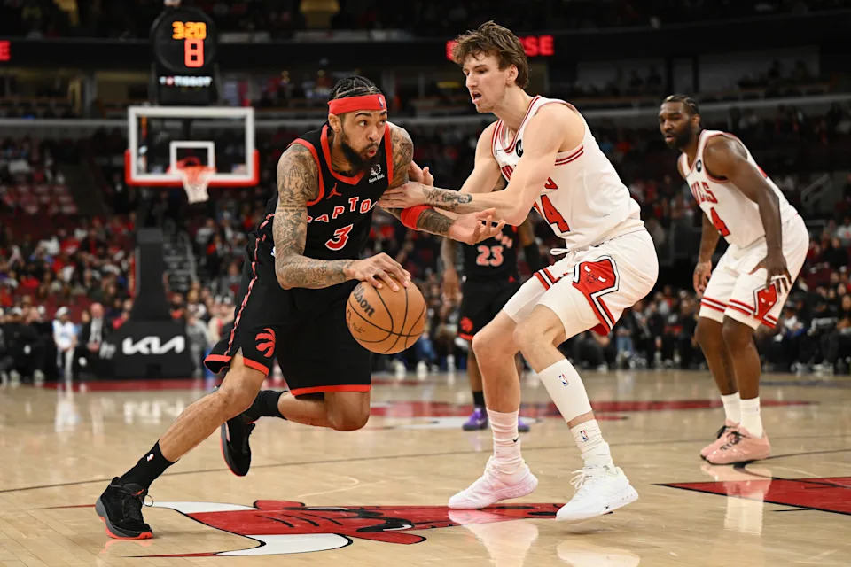 CHICAGO, ILLINOIS - FEBRUARY 19: Brandon Ingram #3 of the Toronto Raptors dribbles the ball as Matas Buzelis #14 of the Chicago Bulls defends during the second half at the United Center on February 19, 2026 in Chicago, Illinois. NOTE TO USER: User expressly acknowledges and agrees that, by downloading and or using this photograph, User is consenting to the terms and conditions of the Getty Images License Agreement. (Photo by Daniel Bartel/Getty Images)