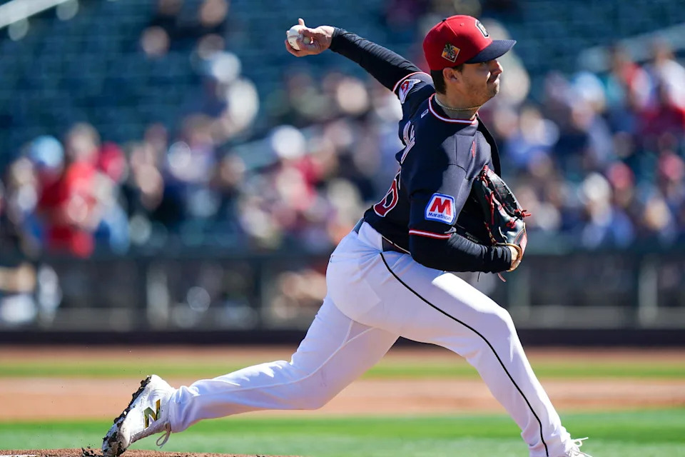Cleveland Guardians pitcher Logan Allen (26) delivers a pitch in the first inning of a Cactus League game between the Cincinnati Reds and Cleveland Guardians, Saturday, Feb. 21, 2026, at Goodyear Ballpark in Goodyear, Ariz.