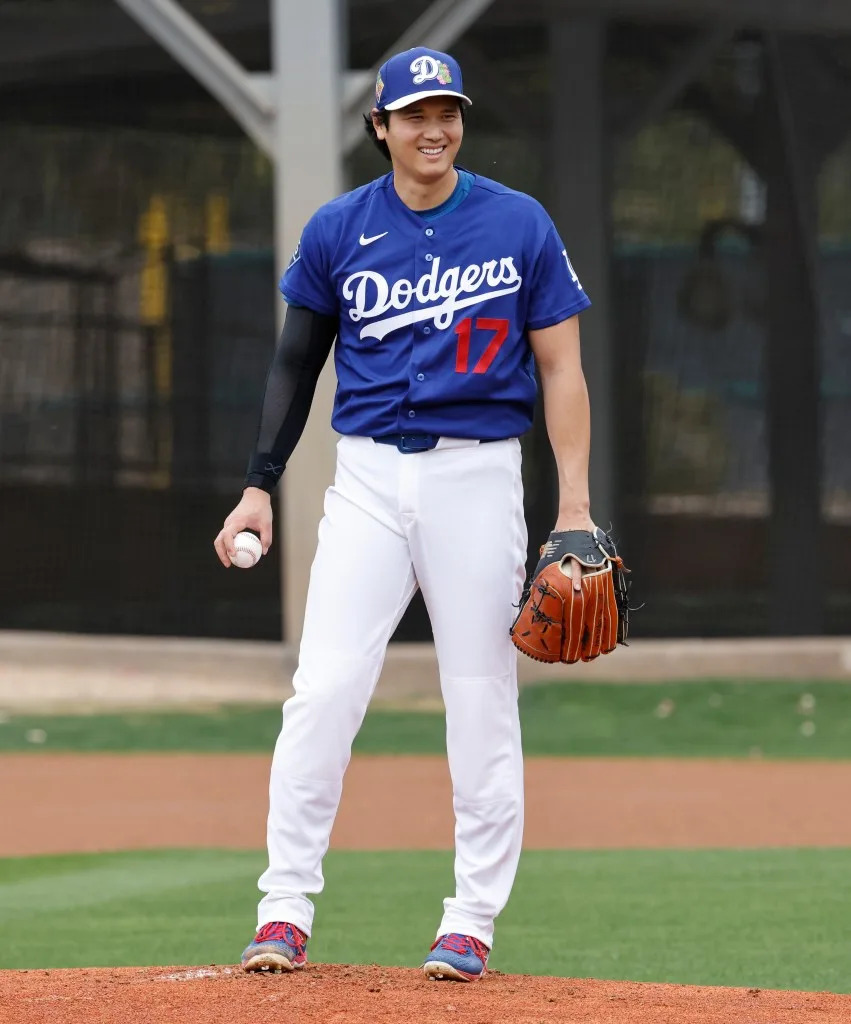 Shohei Ohtani smiling in his Los Angeles Dodgers uniform during spring training. JASON SZENES FOR THE CALIFORNIA POST
