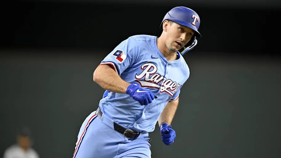 Texas Rangers left fielder Wyatt Langford rounds the bases.
