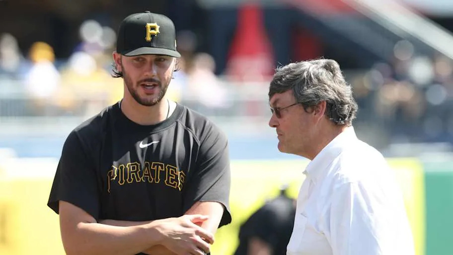 Pittsburgh Pirates pitcher Paul Skenes (30) talks with Pirates owner Robert Nutting