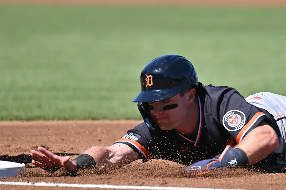 Detroit Tigers shortstop Kevin McGonigle (85) dives back to first base in the first inning against the Atlanta Braves during spring training at CoolToday Park in North Port, Florida, on Tuesday, Feb. 24, 2026.