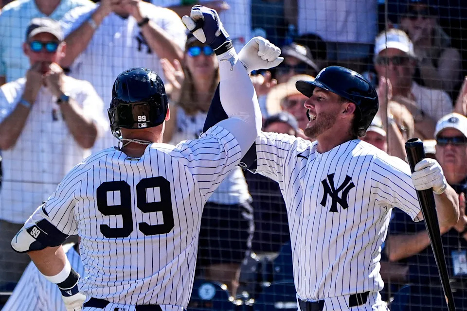 New York Yankees right fielder Aaron Judge (99) celebrates a 2-run home run against Detroit Tigers with third baseman Ryan McMahon (19) during the fourth inning at George M. Steinbrenner Field in Tampa, Fla. on Saturday, Feb. 21, 2026.