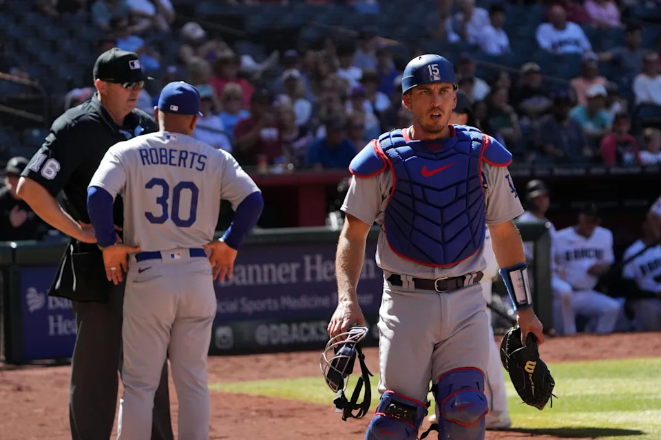 Los Angeles Dodgers manager Dave Roberts (30) talks with home plate umpire Lance Barrett (16) after Los Angeles Dodgers catcher Austin Barnes (15) was ejected from the game during the fifth inning against the Arizona Diamondbacks at Chase Field.
