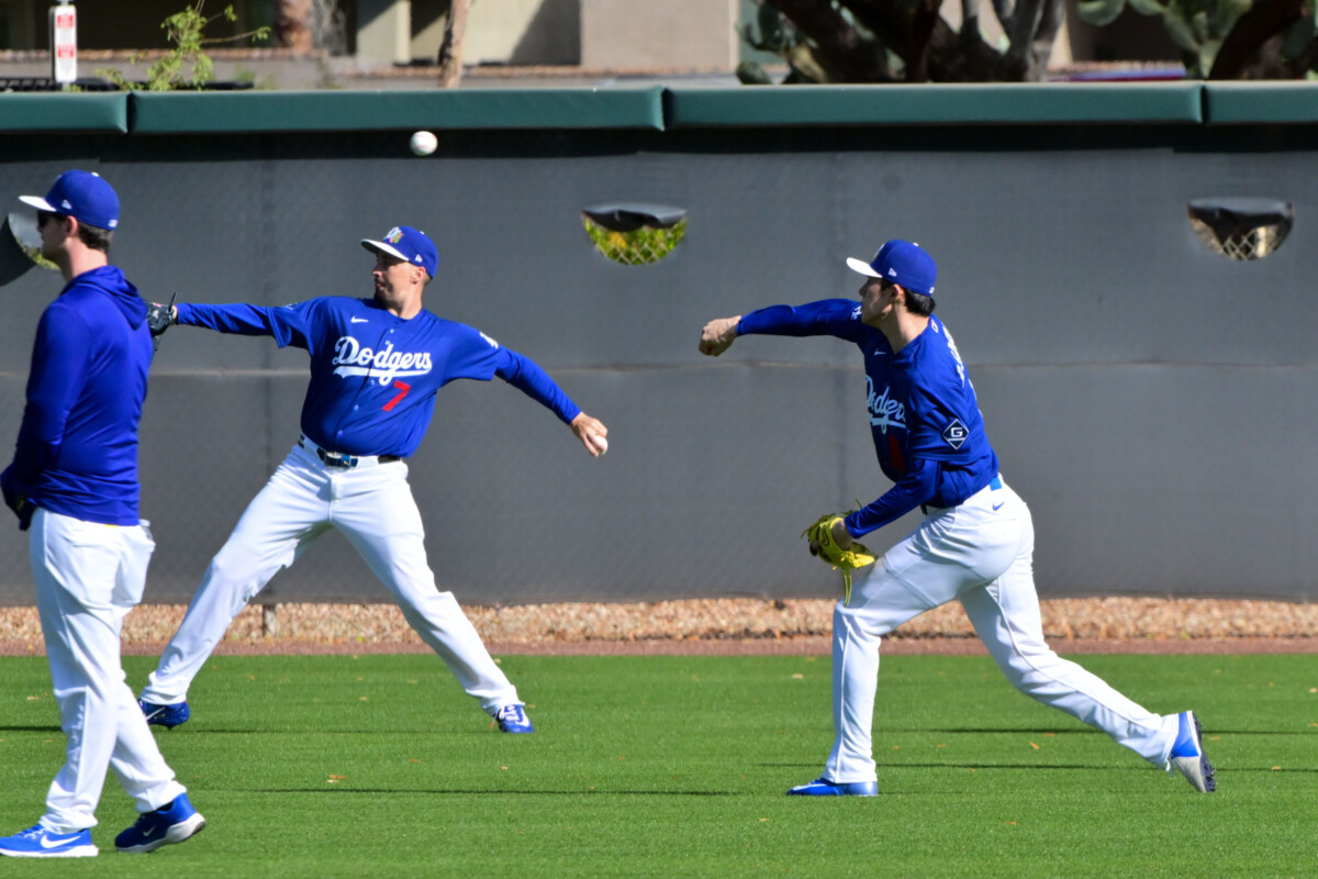 Feb 17, 2026; Glendale, AZ, USA; Los Angeles Dodgers pitcher Roki Sasaki (11) and pitcher Blake Snell (7) warm up during a Spring Training workout at Camelback Ranch. Mandatory Credit: Matt Kartozian-Imagn Images