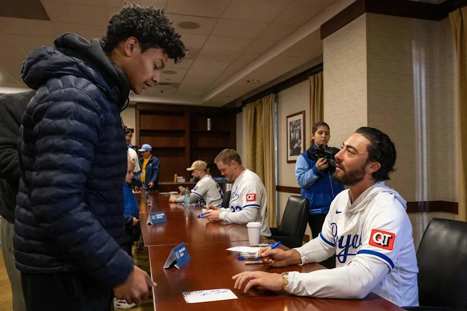 Kansas City Royals second baseman Jonathan India gives his signature to Thomas Smith during Royals Rally at Kauffman Stadium on Saturday, January 31, 2026. Dominick Williams/dowilliams@kcstar.com