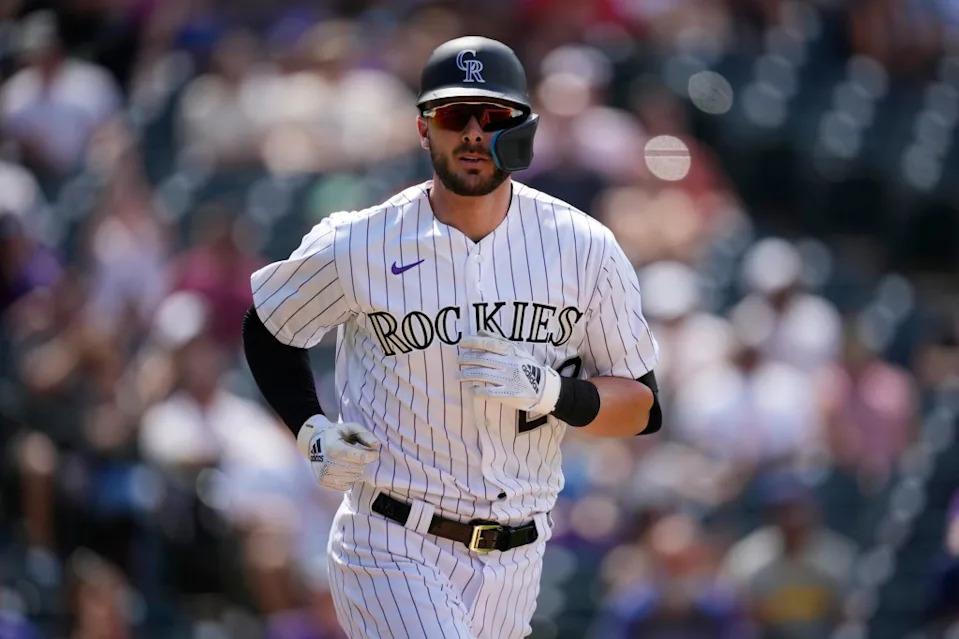 Kris Bryant heads to first base after drawing a walk with the bases loaded to force in a run during the Rockies’ win over the Padres on July 14, 2022, in Denver. AP
