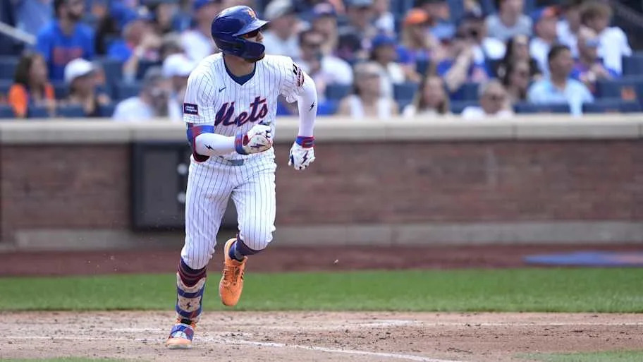 Brandon Nimmo running out of the box for the New York Mets.