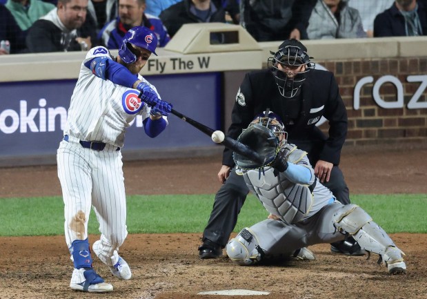 Cubs first baseman Michael Busch connects for a solo home run in the eighth inning against the Brewers in Game 4 of the NLCS at Wrigley Field on Oct. 9, 2025, in Chicago. (John J. Kim/Chicago Tribune)