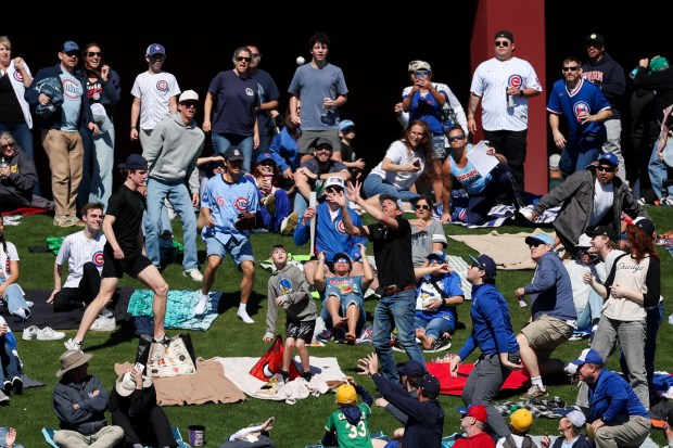 Chicago White Sox left fielder Austin Hays' (21) solo-homer ball fly's into the fans grass area in the first inning against the Chicago Cubs during the Cubs and White Sox first spring training game of the year at Sloan Park Friday Feb. 20, 2026 in Mesa, Ariz. (Armando L. Sanchez/Chicago Tribune)