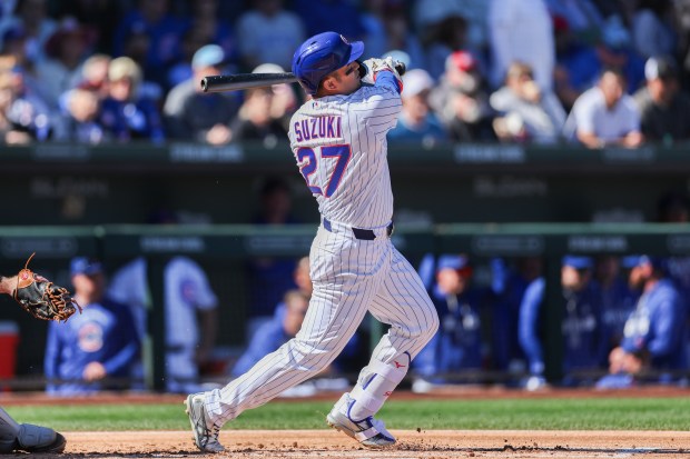 Chicago Cubs right fielder Seiya Suzuki (27) hits a solo-homer in the first inning against the Chicago White Sox during the Cubs and White Sox first spring training game of the year at Sloan Park Friday Feb. 20, 2026 in Mesa, Ariz. (Armando L. Sanchez/Chicago Tribune)