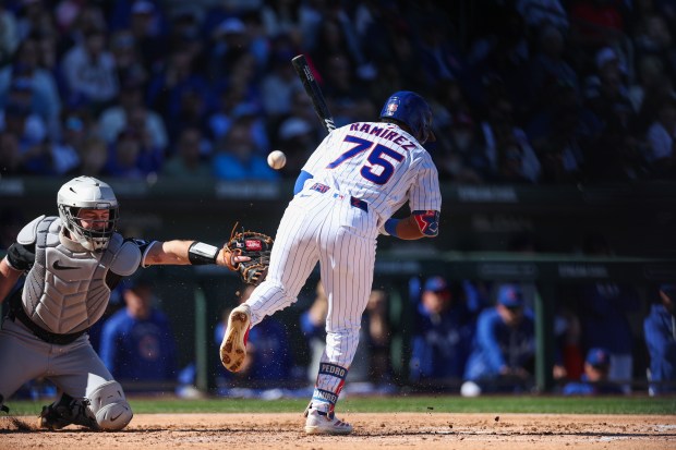 Chicago Cubs second baseman Pedro Ramirez (75) gets walked after being hit by a pitch from Chicago White Sox pitcher Jonathan Cannon (48) in the second inning during the Cubs and White Sox first spring training game of the year at Sloan Park Friday Feb. 20, 2026 in Mesa, Ariz. (Armando L. Sanchez/Chicago Tribune)
