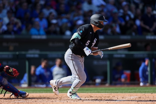 Chicago White Sox first baseman Munetaka Murakami (5) hits a single in the third inning against the Chicago Cubs during the Cubs and White Sox first spring training game of the year at Sloan Park Friday Feb. 20, 2026 in Mesa, Ariz. (Armando L. Sanchez/Chicago Tribune)