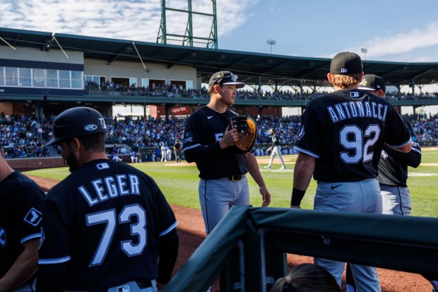 Chicago White Sox first baseman Munetaka Murakami (5) high-fives players after the third inning against the Chicago Cubs during the Cubs and White Sox first spring training game of the year at Sloan Park Friday Feb. 20, 2026 in Mesa, Ariz. (Armando L. Sanchez/Chicago Tribune)