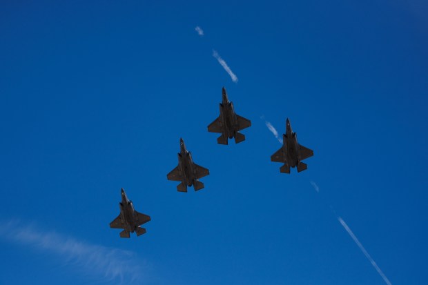Fight jets fly over the field during the national anthem before the Chicago Cubs play the Chicago White Sox during the Cubs and White Sox first spring training game of the year at Sloan Park Friday Feb. 20, 2026 in Mesa, Ariz. (Armando L. Sanchez/Chicago Tribune)
