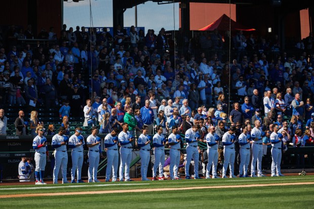 Chicago Cubs players stand for the national anthem before playing against the Chicago White Sox during the Cubs and White Sox first spring training game of the year at Sloan Park Friday Feb. 20, 2026 in Mesa, Ariz. (Armando L. Sanchez/Chicago Tribune)
