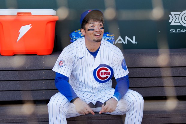 Chicago Cubs right fielder Seiya Suzuki (27) sits in the dugout before playing against the Chicago White Sox during the Cubs and White Sox first spring training game of the year at Sloan Park Friday Feb. 20, 2026 in Mesa, Ariz. (Armando L. Sanchez/Chicago Tribune)