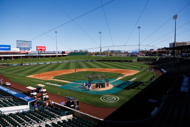 Chicago Cubs players warm up on the field before playing the Texas Rangers in a Cactus League game at Sloan Park Saturday Feb. 21, 2026 in Mesa, Ariz. (Armando L. Sanchez/Chicago Tribune)
