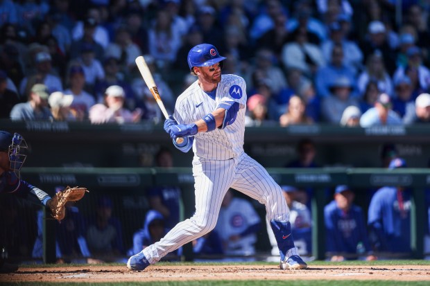 Chicago Cubs catcher Carson Kelly (15) swings at the plate before hitting a ground-out during the first inning against the Texas Rangers in a Cactus League game at Sloan Park Saturday Feb. 21, 2026 in Mesa, Ariz. (Armando L. Sanchez/Chicago Tribune)