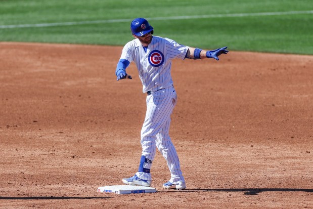 Chicago Cubs catcher Carson Kelly (15) gestures after hitting a double during the third inning against the Texas Rangers in a Cactus League game at Sloan Park Saturday Feb. 21, 2026 in Mesa, Ariz. (Armando L. Sanchez/Chicago Tribune)
