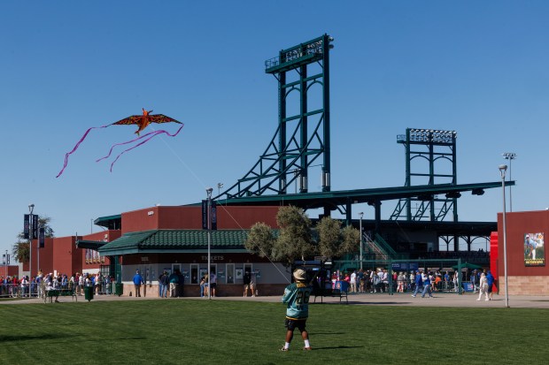Abel Valeriana, 30, flys a kite before the Chicago Cubs play the Texas Rangers in a Cactus League game at Sloan Park Saturday Feb. 21, 2026 in Mesa, Ariz. (Armando L. Sanchez/Chicago Tribune)