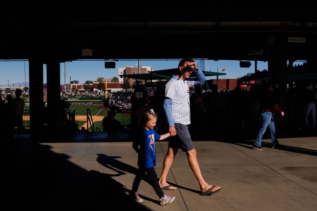 Fans walk through the concourse as the Chicago Cubs play the Texas Rangers during the ninth inning of a Cactus League game at Sloan Park Saturday Feb. 21, 2026 in Mesa, Ariz. (Armando L. Sanchez/Chicago Tribune)