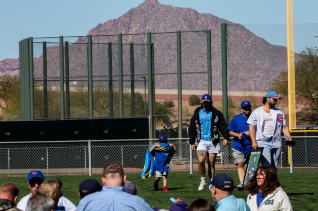 Fans walk outside the ballpark before the Chicago Cubs play the Texas Rangers in a Cactus League game at Sloan Park Saturday Feb. 21, 2026 in Mesa, Ariz. (Armando L. Sanchez/Chicago Tribune)