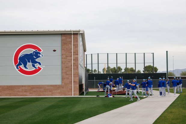 Pitchers warm up during the first day of the Cubs full-squad workout at spring training at Sloan Park on Feb. 16, 2026, in Mesa, Ariz. (Armando L. Sanchez/Chicago Tribune)