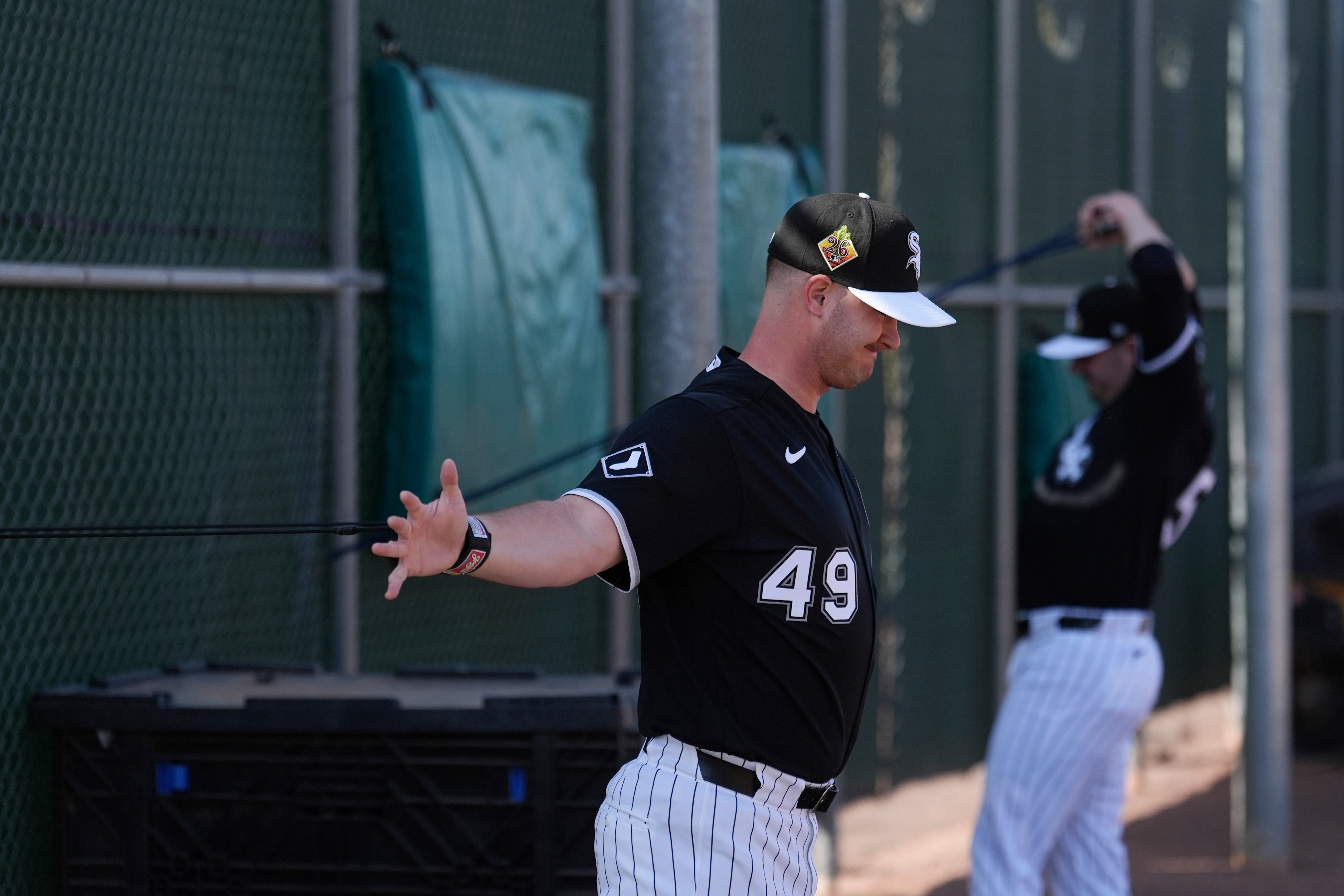 White Sox pitchers Jordan Leasure, left, and Brandon Eisert warm...