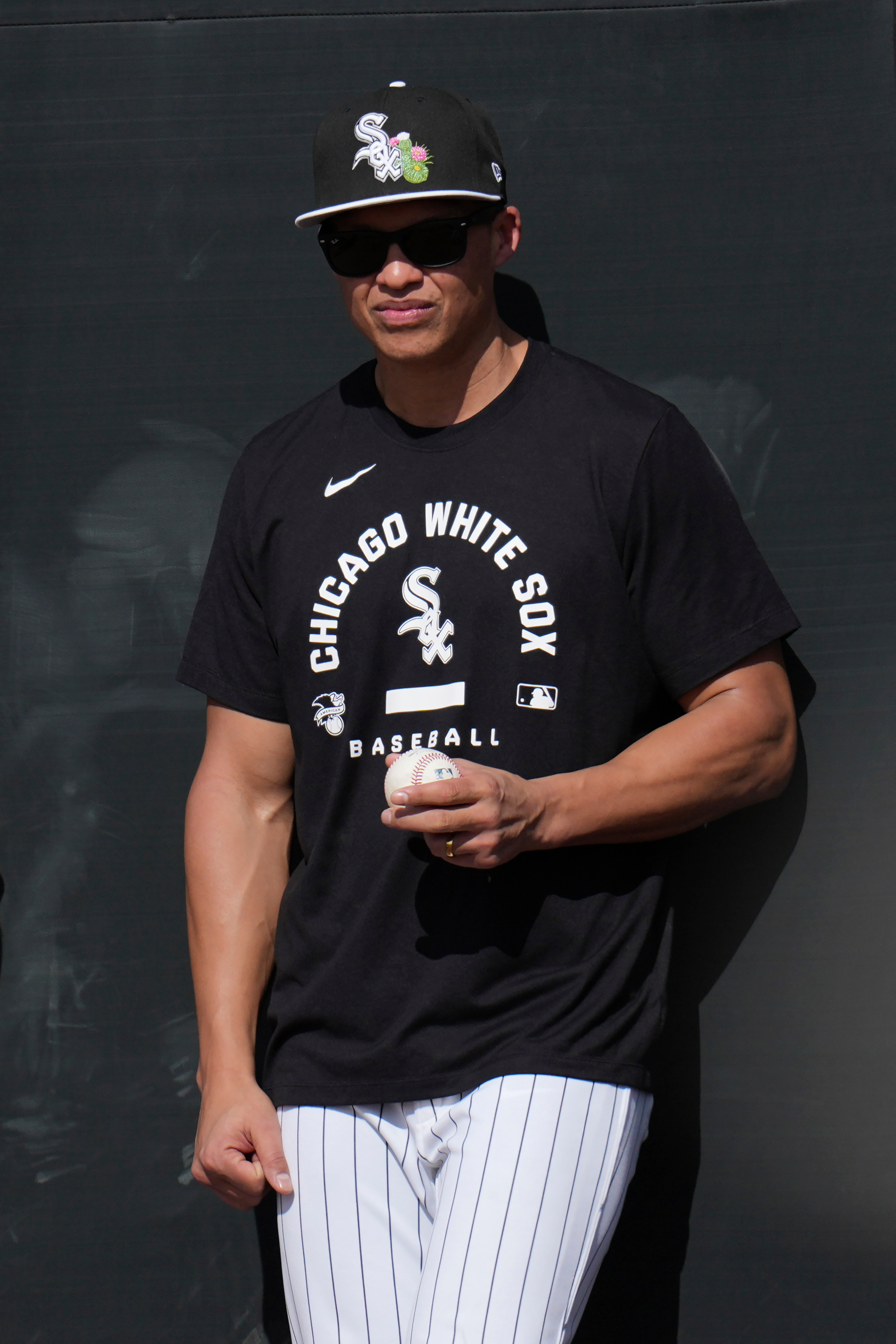 White Sox manager Will Venable watches pitchers and catchers during...